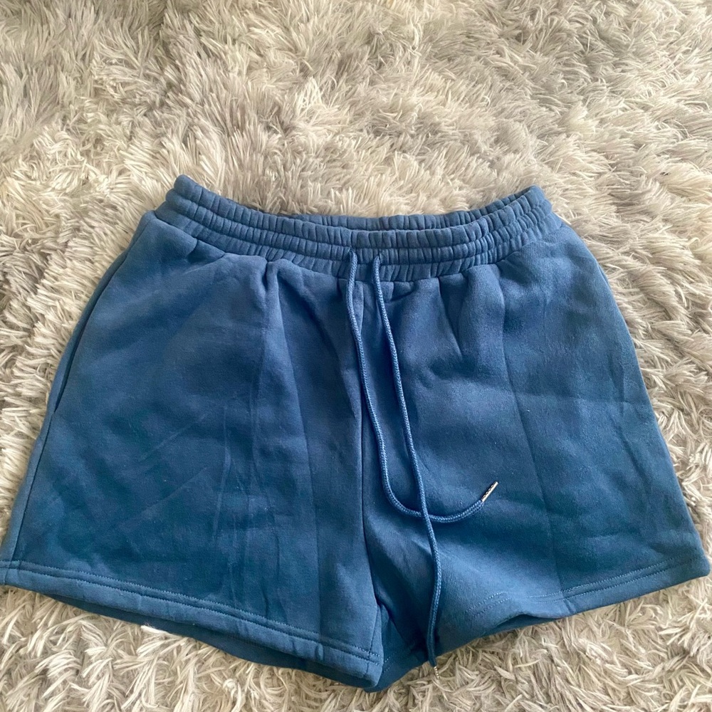 Light Blue Athletic Shorts with Elastic Waistband and Relaxed Fit